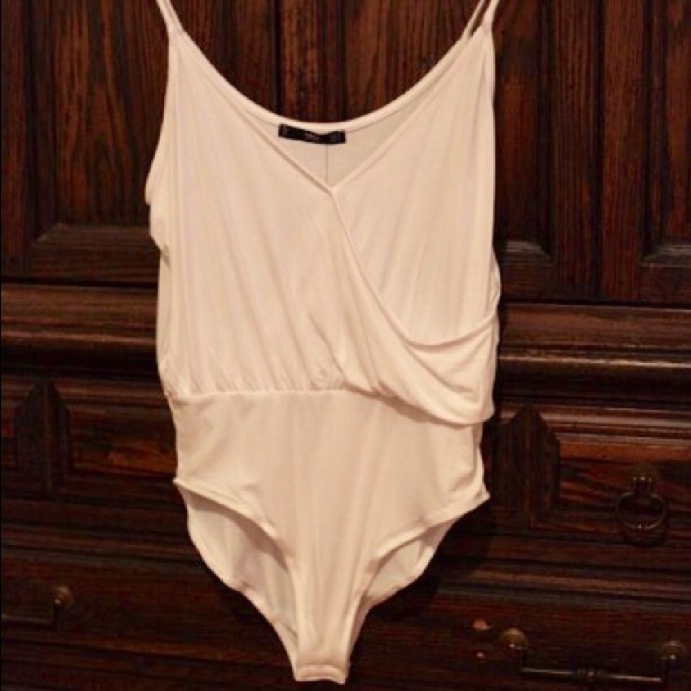 White deep V draped body suit by Mango.